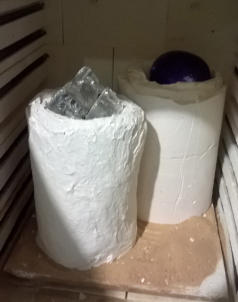 Moulds with glass in ready to be fired