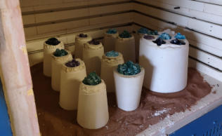 Moulds with glass in ready to be fired